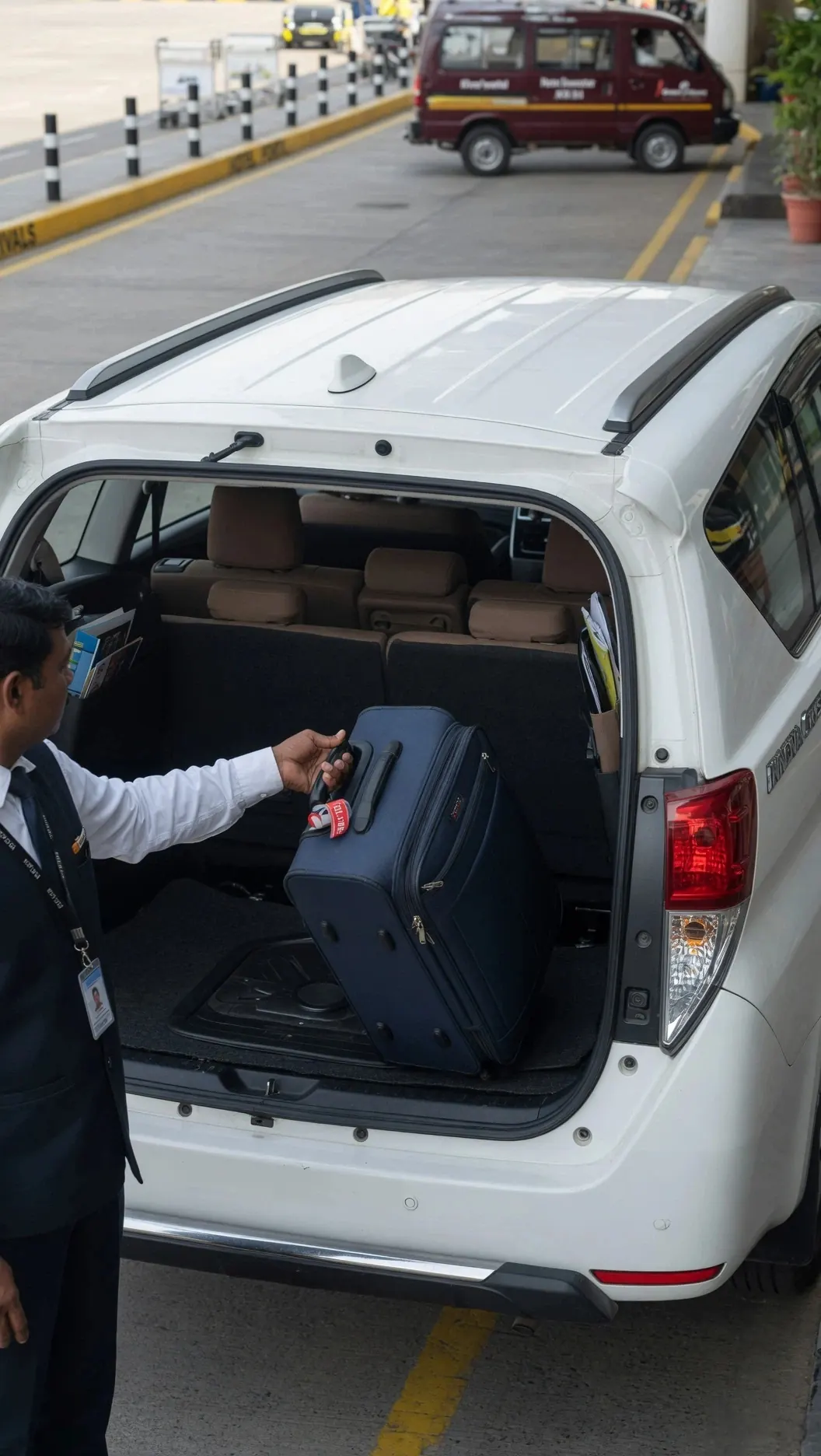 AirportLive chauffeur loading luggage for airport pickup and drop service